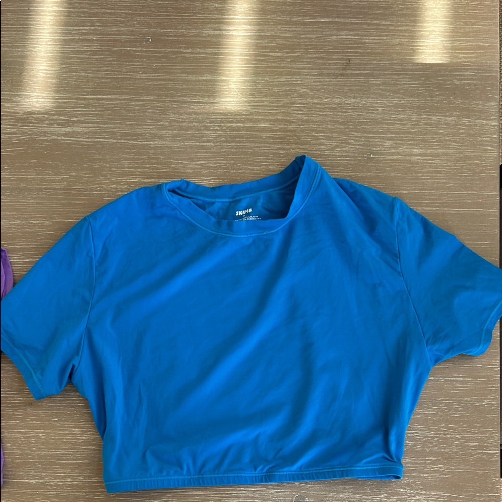 SKIMS Blue and Purple Short Sleeve cropped swim Tees - Picture 4 of 6